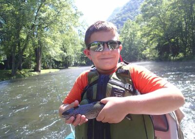 Happy child learning to fly fish - Endless River Adventures Fly Fishing